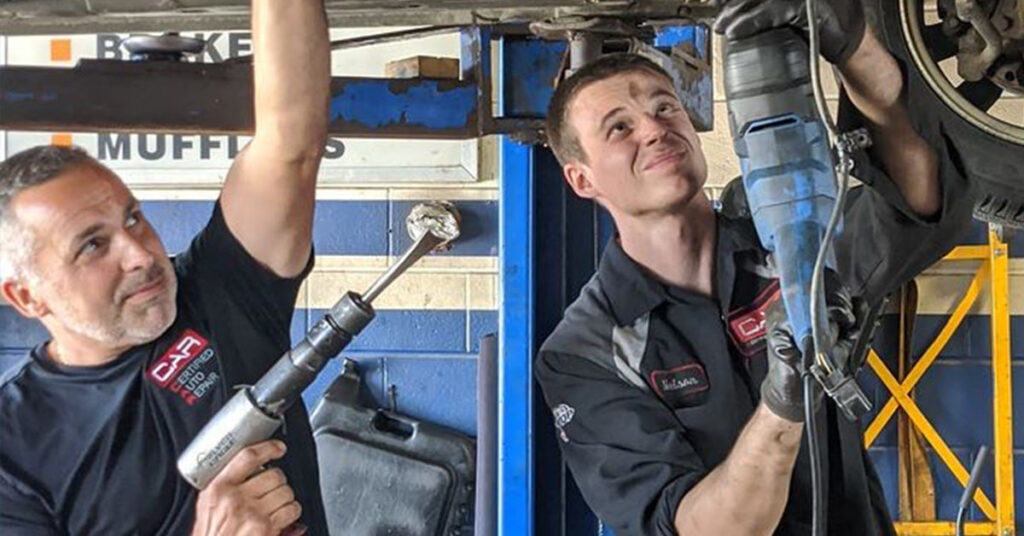 Auto mechanics at Nelson’s Certified Auto Repair in Ontario, Canada wear UniFirst uniforms