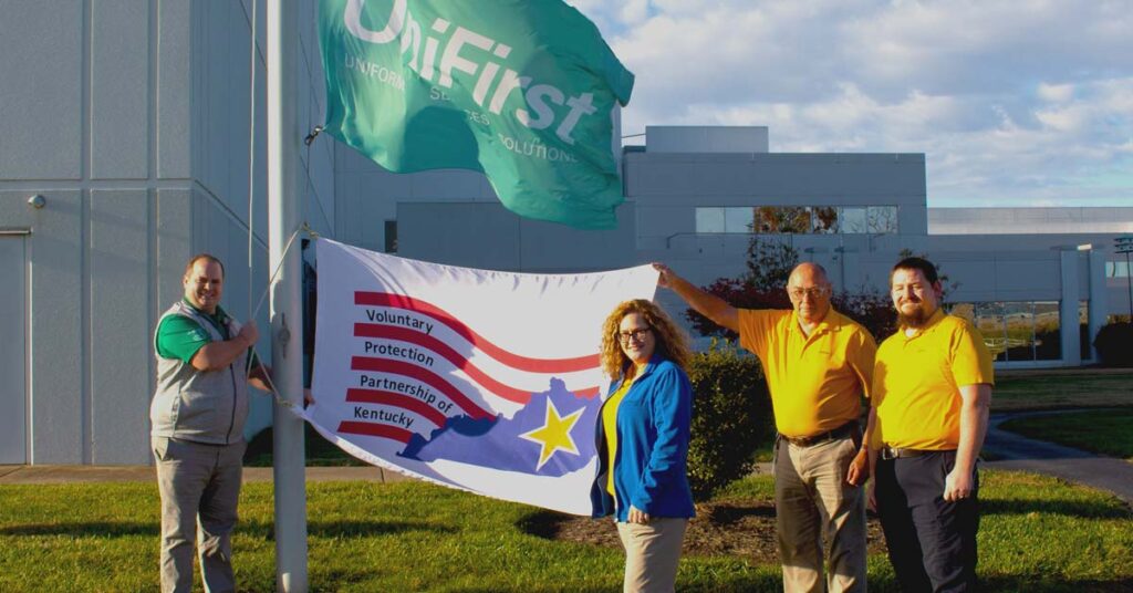 UniFirst safety team raise the OSHA workplace protection flag