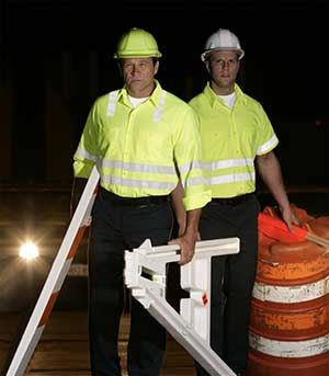 Roadway workers wearing hi-vis apparel at night