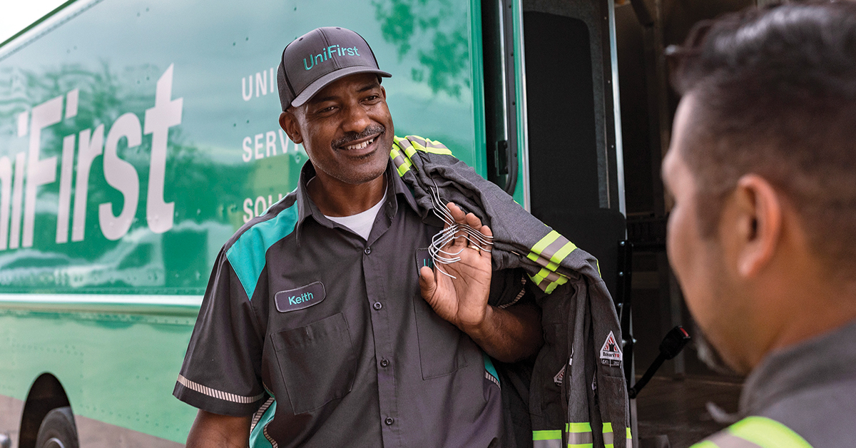 Elevate your uniform rental service with UniFirst. Our UniFirst RSR delivering uniforms to our customers.