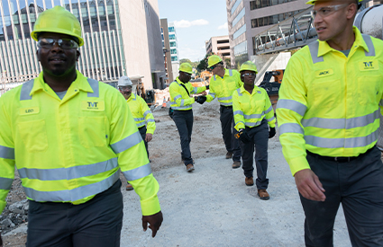 A group of construction workers wearing high visibility