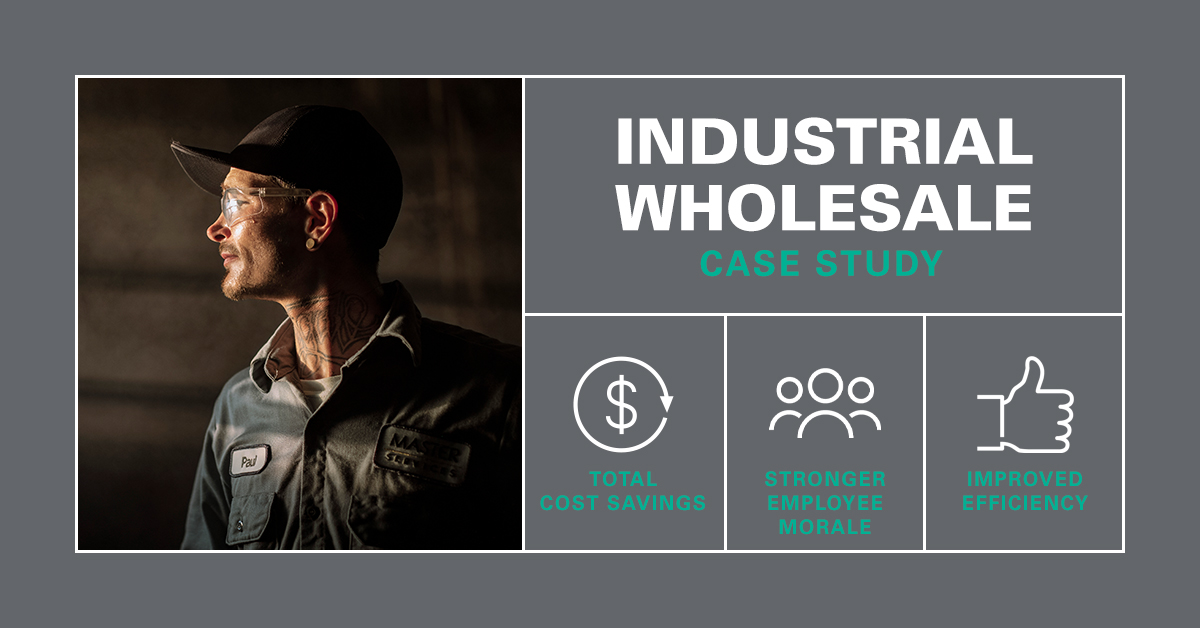 Industrial wholesale worker standing in UniFirst uniform pants and shirt