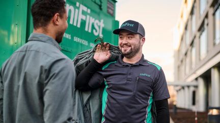 Elevate your uniform rental service with UniFirst. Our UniFirst RSR delivering uniforms to our customers.