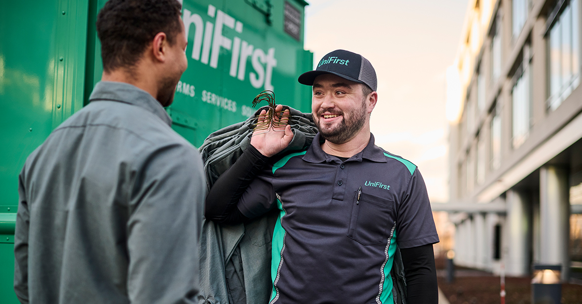 Elevate your uniform rental service with UniFirst. Our UniFirst RSR delivering uniforms to our customers.