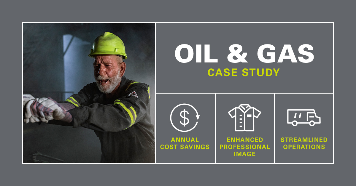 Man in the oil and gas industry using strength pushes a lever wearing a UniFirst flame resistant garment