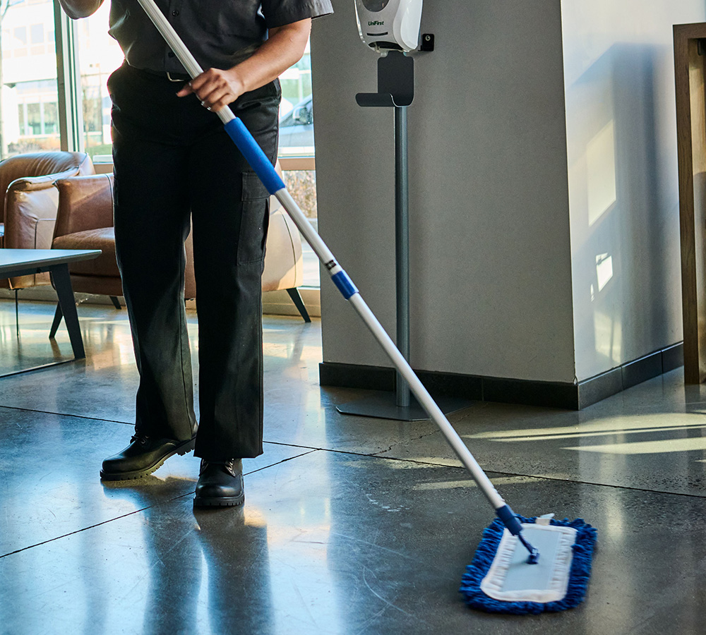 UniFirst microfiber mop is shown. UniFirst facility services saved this fast food restaurant $1.3 million dollars annually.