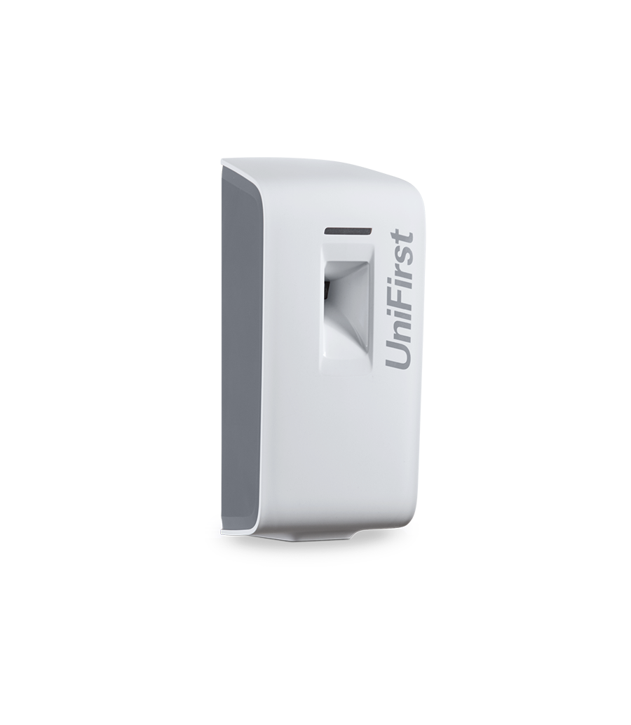 Essential Series metered spray air freshener dispenser pictured in white with a sleek, modern design