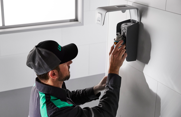 A UniFirst RSR managing inventory of the Essential Series air freshener