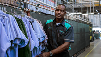 A UniFirst Route Service Representative collecting uniforms as part of UniFirst's uniform service