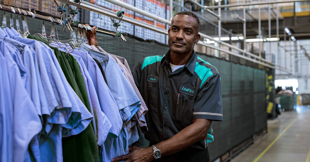 A UniFirst Route Service Representative collecting uniforms as part of UniFirst's uniform service